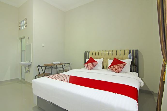 Imagen de la habitación del Hotel Capital O 91675 Utama Residence. Foto 6