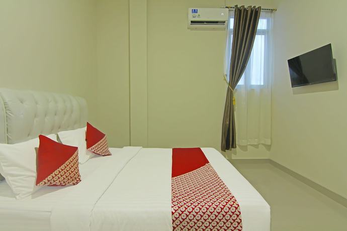 Imagen de la habitación del Hotel Capital O 91675 Utama Residence. Foto 8