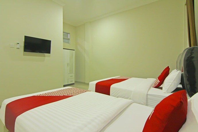 Imagen de la habitación del Hotel Capital O 91675 Utama Residence. Foto 11