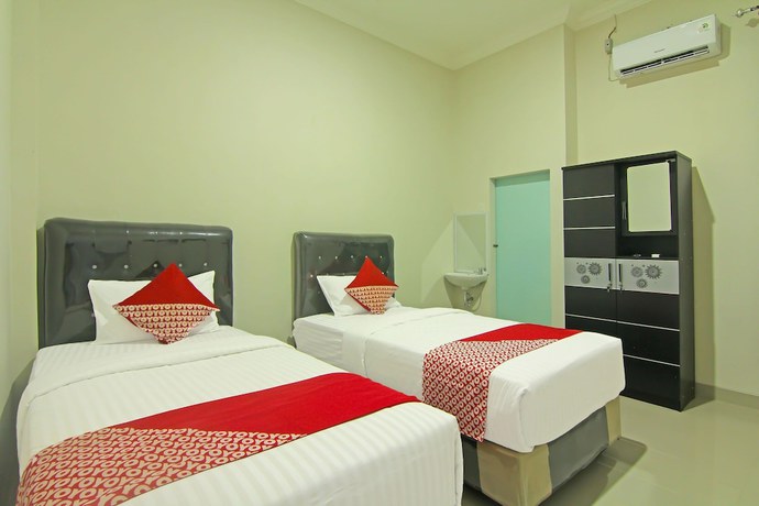 Imagen de la habitación del Hotel Capital O 91675 Utama Residence. Foto 12