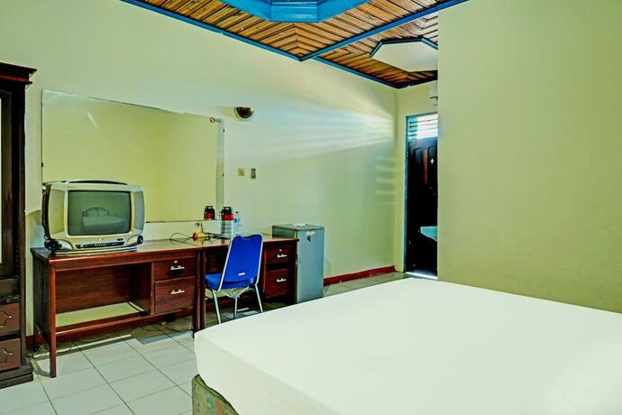 Imagen de la habitación del Hotel Capital O 91806 Batu Suli. Foto 12