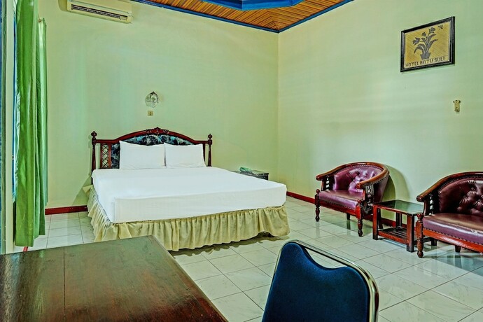 Imagen de la habitación del Hotel Capital O 91806 Batu Suli. Foto 14