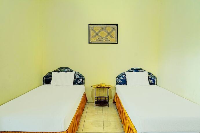 Imagen de la habitación del Hotel Capital O 91806 Batu Suli. Foto 15