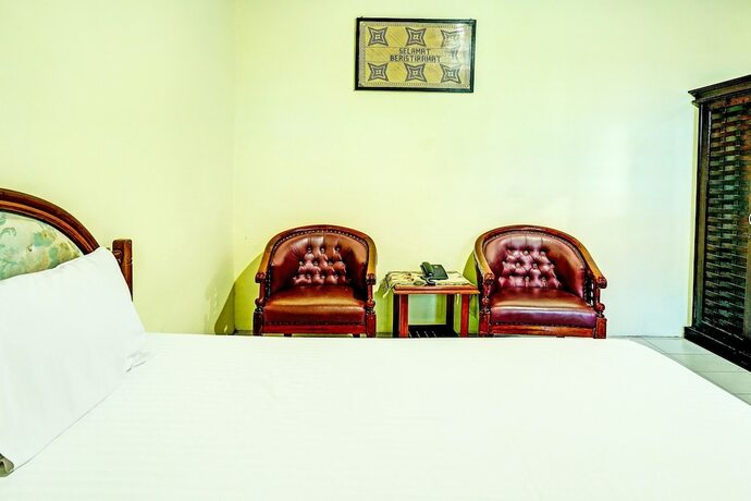 Imagen de la habitación del Hotel Capital O 91806 Batu Suli. Foto 16