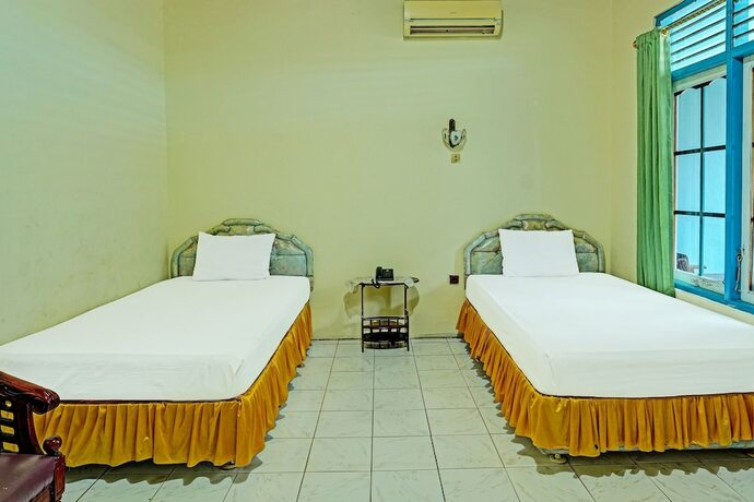 Imagen de la habitación del Hotel Capital O 91806 Batu Suli. Foto 17