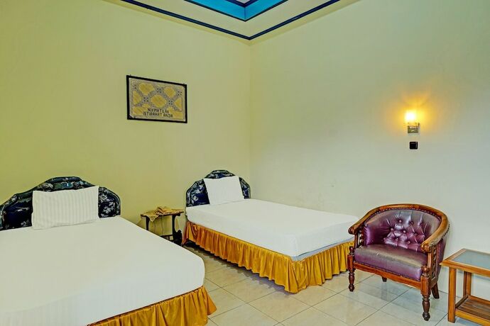 Imagen de la habitación del Hotel Capital O 91806 Batu Suli. Foto 18