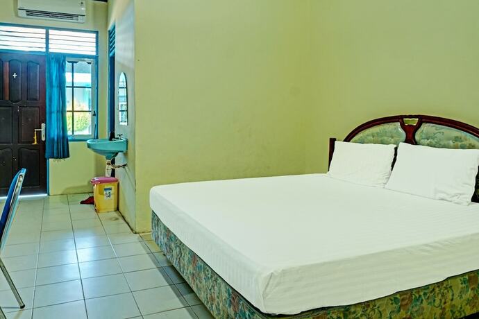 Imagen de la habitación del Hotel Capital O 91806 Batu Suli. Foto 19