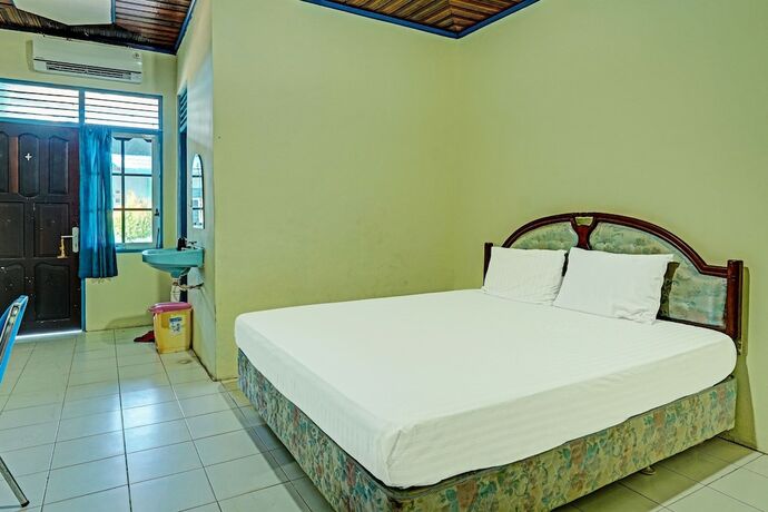 Imagen de la habitación del Hotel Capital O 91806 Batu Suli. Foto 20