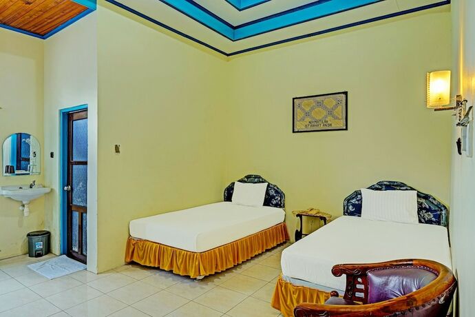 Imagen de la habitación del Hotel Capital O 91806 Batu Suli. Foto 21