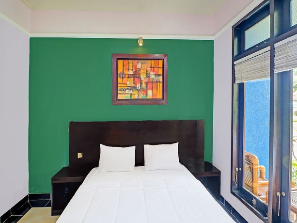 Imagen de la habitación del Hotel Capital O 91836 Pondok Bambu. Foto 1