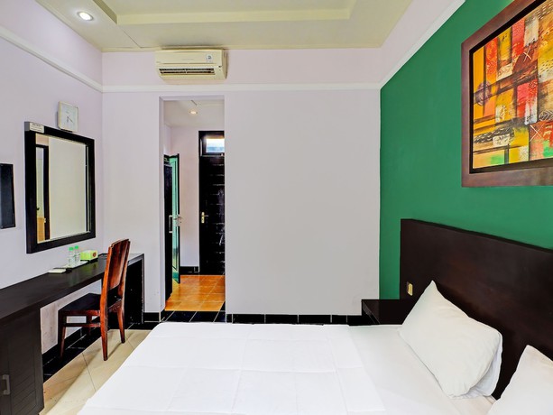 Imagen de la habitación del Hotel Capital O 91836 Pondok Bambu. Foto 3