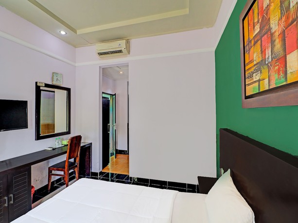 Imagen de la habitación del Hotel Capital O 91836 Pondok Bambu. Foto 4