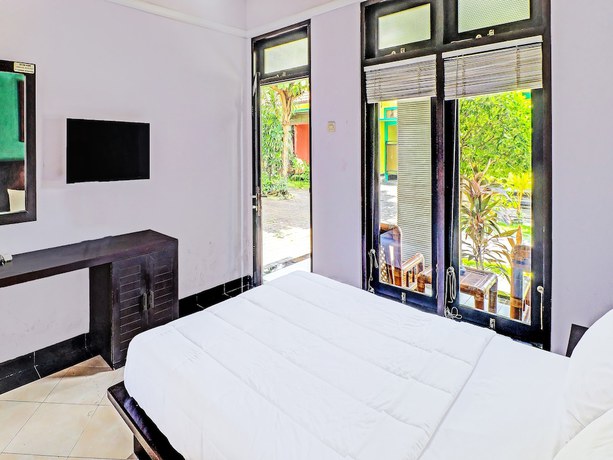 Imagen de la habitación del Hotel Capital O 91836 Pondok Bambu. Foto 5