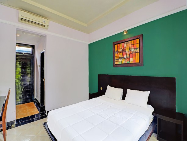 Imagen de la habitación del Hotel Capital O 91836 Pondok Bambu. Foto 6