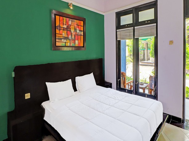 Imagen de la habitación del Hotel Capital O 91836 Pondok Bambu. Foto 7