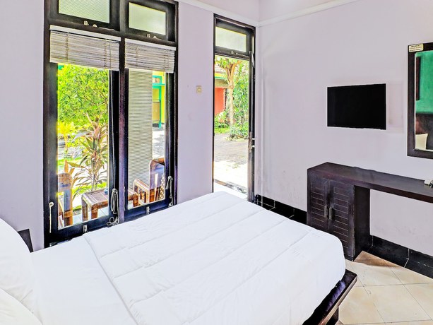 Imagen de la habitación del Hotel Capital O 91836 Pondok Bambu. Foto 8