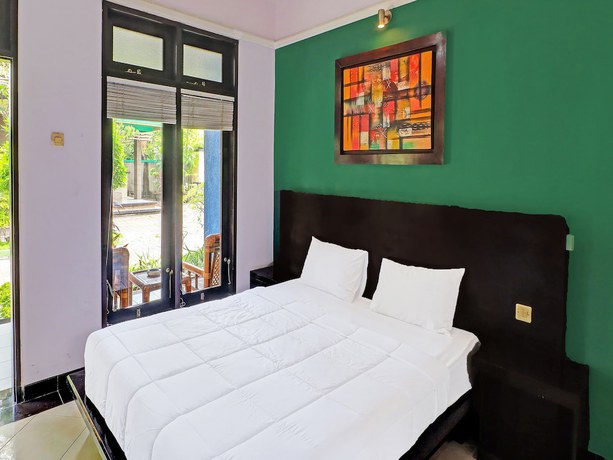 Imagen de la habitación del Hotel Capital O 91836 Pondok Bambu. Foto 9