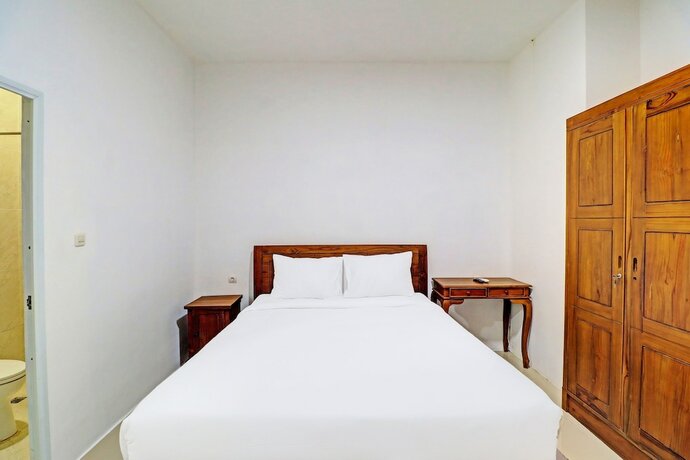 Imagen de la habitación del Hotel Capital O 92039 Runways House. Foto 20