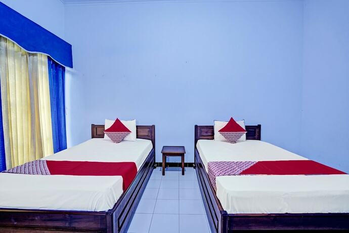 Imagen de la habitación del Hotel Capital O 92162 Wisata Karya. Foto 16