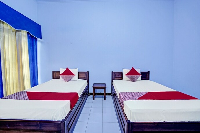 Imagen de la habitación del Hotel Capital O 92162 Wisata Karya. Foto 20