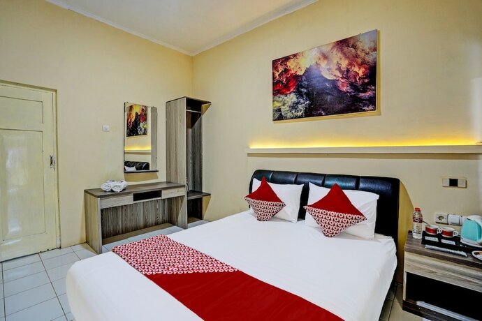 Imagen de la habitación del Hotel Capital O 92162 Wisata Karya. Foto 22