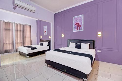 Imagen de la habitación del Hotel Capital O 92250 Hall & Guesthouse Kowapi Syariah. Foto 18