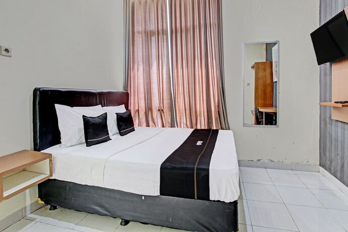 Imagen de la habitación del Hotel Capital O 92295 Double Tree. Foto 15