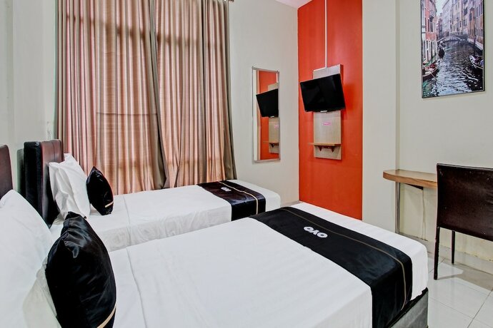 Imagen de la habitación del Hotel Capital O 92295 Double Tree. Foto 17