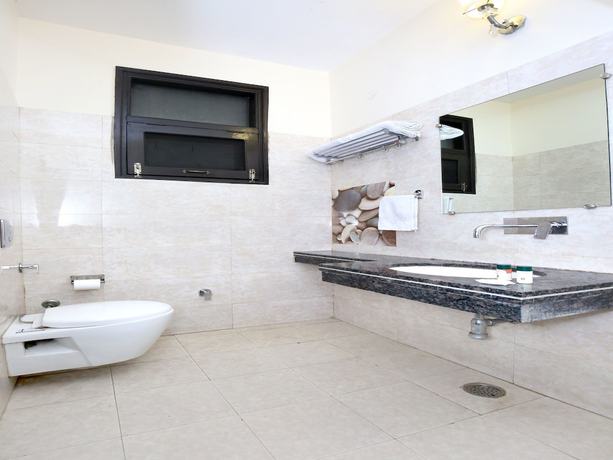 Imagen de la habitación del Hotel Capital O 9235 Nayyar. Foto 16