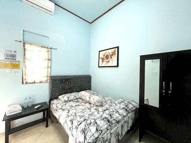 Imagen de la habitación del Hotel Capital O 92615 Villa Utama D\'alas Purwo. Foto 17