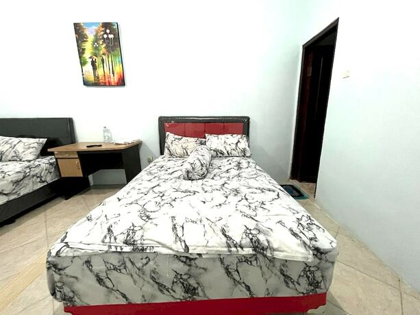 Imagen de la habitación del Hotel Capital O 92615 Villa Utama D\'alas Purwo. Foto 19