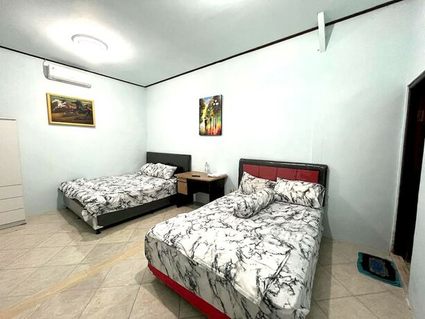 Imagen de la habitación del Hotel Capital O 92615 Villa Utama D\'alas Purwo. Foto 20