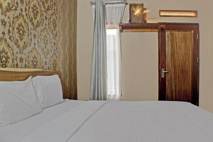 Imagen de la habitación del Hotel Capital O 92681 Randu Mas and Resort Taman Purbakala. Foto 17