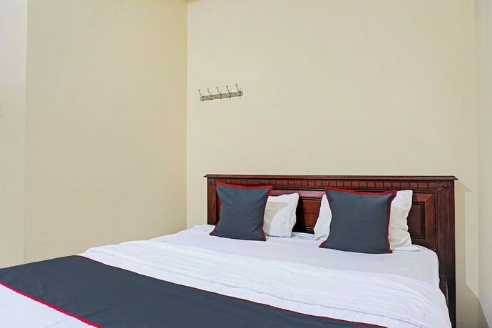 Imagen de la habitación del Hotel Capital O 92867 Villa Raggal. Foto 18