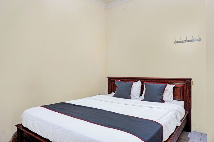 Imagen de la habitación del Hotel Capital O 92867 Villa Raggal. Foto 24