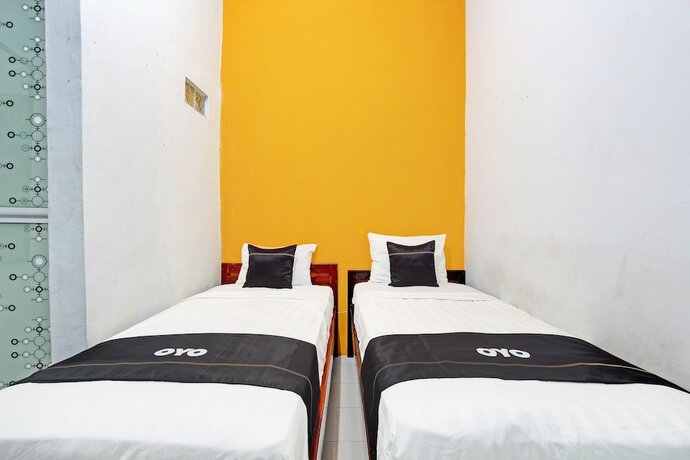 Imagen de la habitación del Hotel Capital O 92929 New Tirta Kencana Syariah. Foto 14