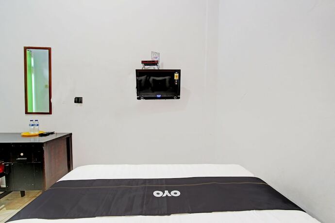 Imagen de la habitación del Hotel Capital O 92929 New Tirta Kencana Syariah. Foto 15