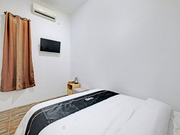 Imagen de la habitación del Hotel Capital O 92963 Global House Syariah. Foto 15