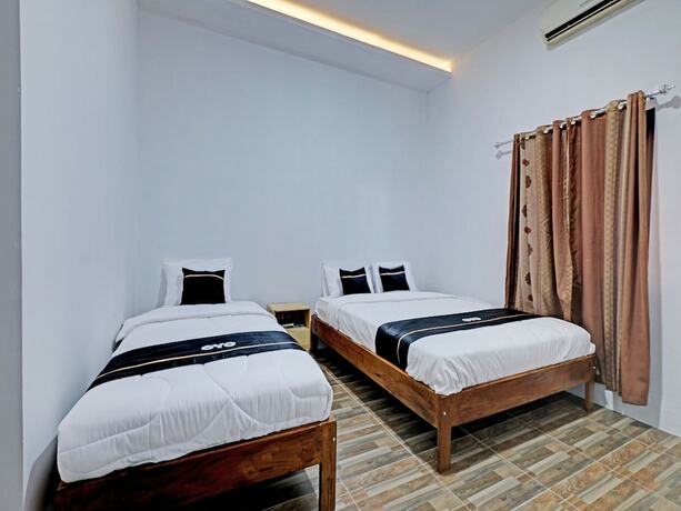 Imagen de la habitación del Hotel Capital O 92963 Global House Syariah. Foto 18