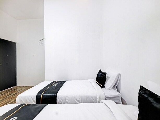 Imagen de la habitación del Hotel Capital O 92963 Global House Syariah. Foto 19