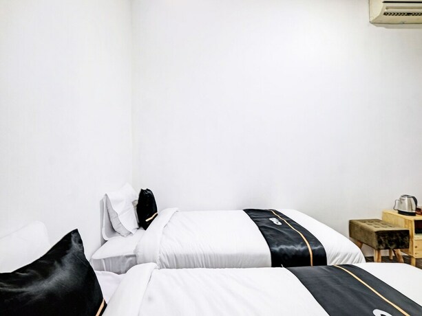 Imagen de la habitación del Hotel Capital O 92963 Global House Syariah. Foto 20