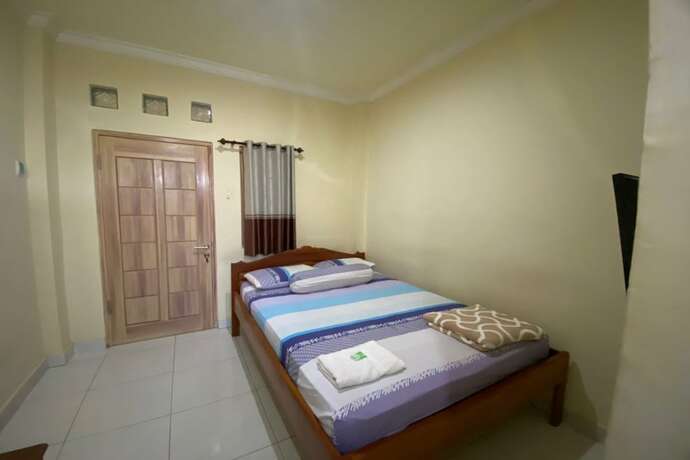Imagen de la habitación del Hotel Capital O 93124 Lombok Northis Homestay. Foto 11