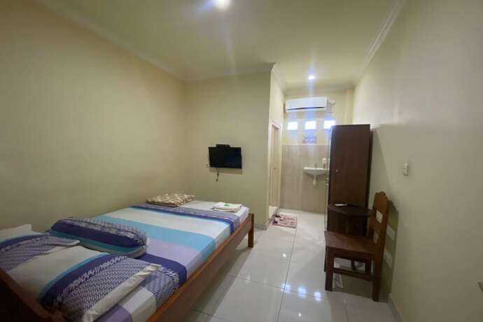 Imagen de la habitación del Hotel Capital O 93124 Lombok Northis Homestay. Foto 12