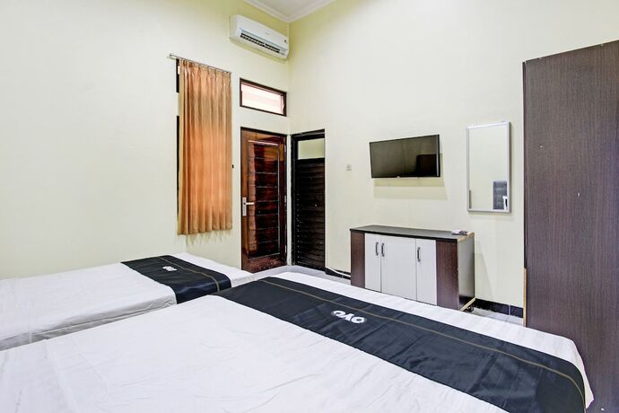 Imagen de la habitación del Hotel Capital O 93204 Mulia Dua Syariah. Foto 17