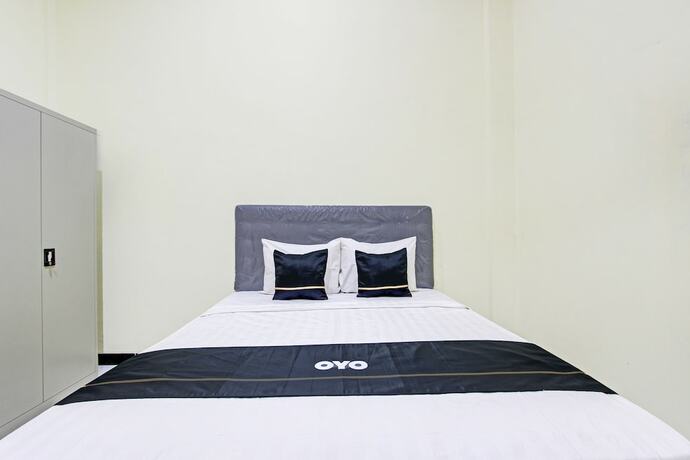 Imagen de la habitación del Hotel Capital O 93204 Mulia Dua Syariah. Foto 20