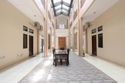 Imagen general del Hotel Capital O 93204 Mulia Dua Syariah. Foto 11