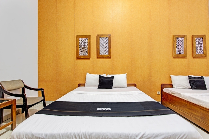 Imagen de la habitación del Hotel Capital O 93240 Candra Dewi. Foto 2