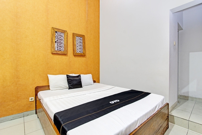 Imagen de la habitación del Hotel Capital O 93240 Candra Dewi. Foto 3