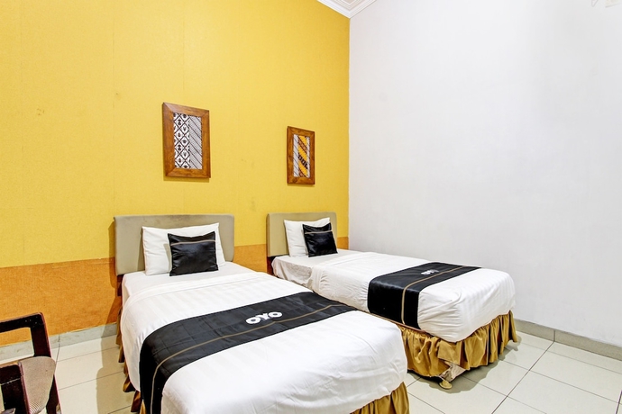 Imagen de la habitación del Hotel Capital O 93240 Candra Dewi. Foto 4