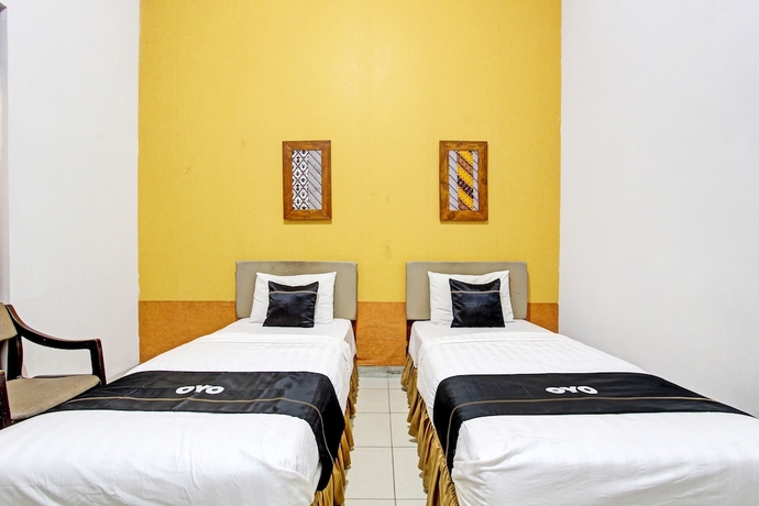 Imagen de la habitación del Hotel Capital O 93240 Candra Dewi. Foto 5